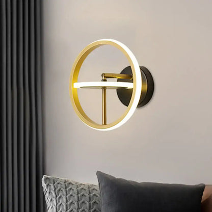 Gold rotatable wall sconce with circular brass ring and integrated LED bar mount Decorbites on Tampa Home & Garden Store