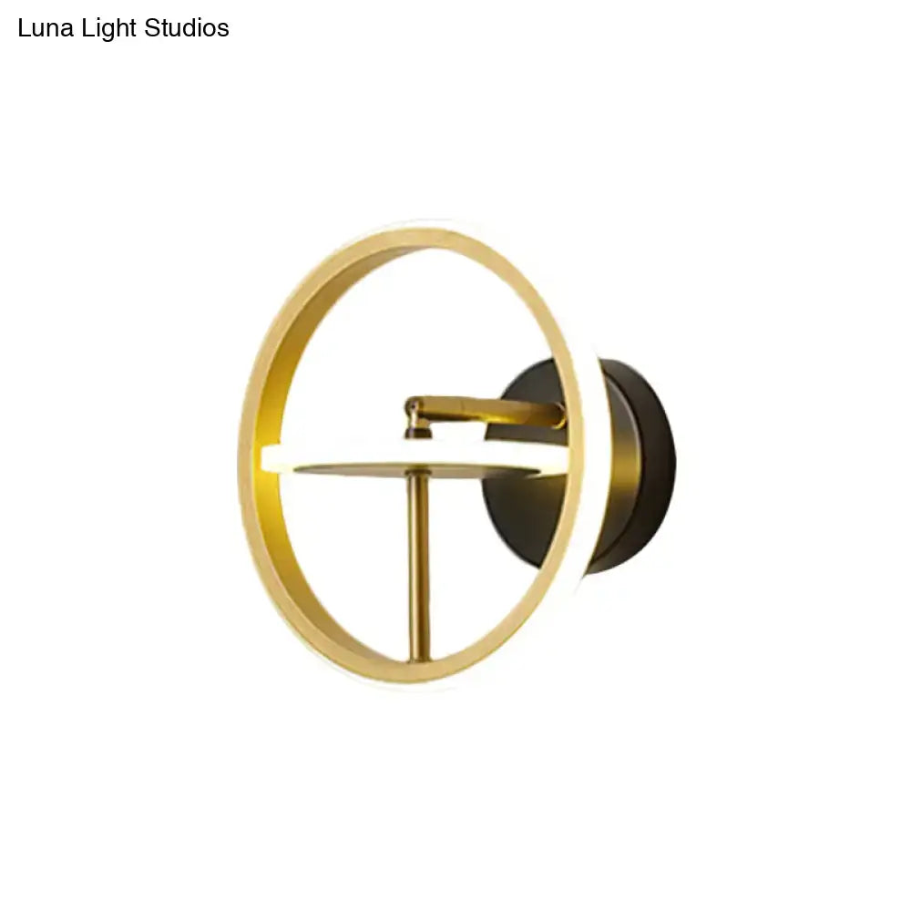 Decorbites gold rotatable wall sconce with circular ring and black mount on Tampa Home & Garden Store