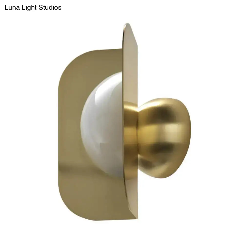 Gold curved metal sconce wall light with white glass globe by Decorbites on Tampa Home & Garden Store