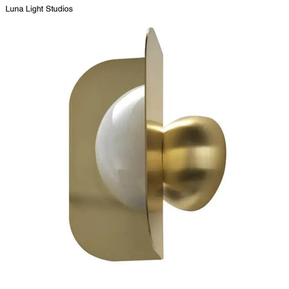 Gold curved metal sconce wall light with white glass globe by Decorbites on Tampa Home & Garden Store