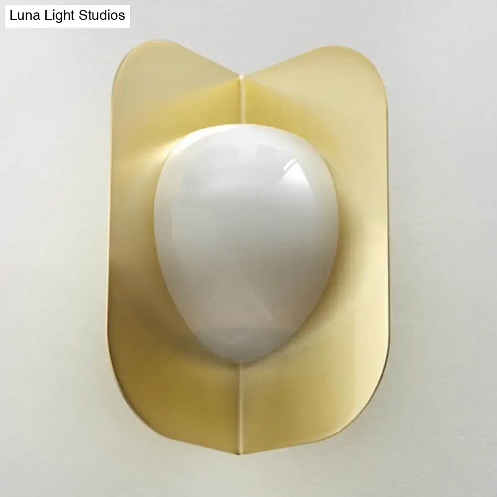 Gold curved metal sconce with white glass orb; wall-mount Decorbites on Tampa Home & Garden Store