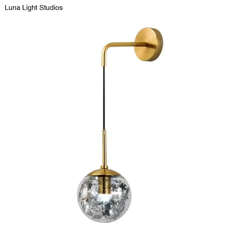 Modern gold shattered leaf clear glass globe wall sconce by Decorbites on Tampa Home & Garden Store