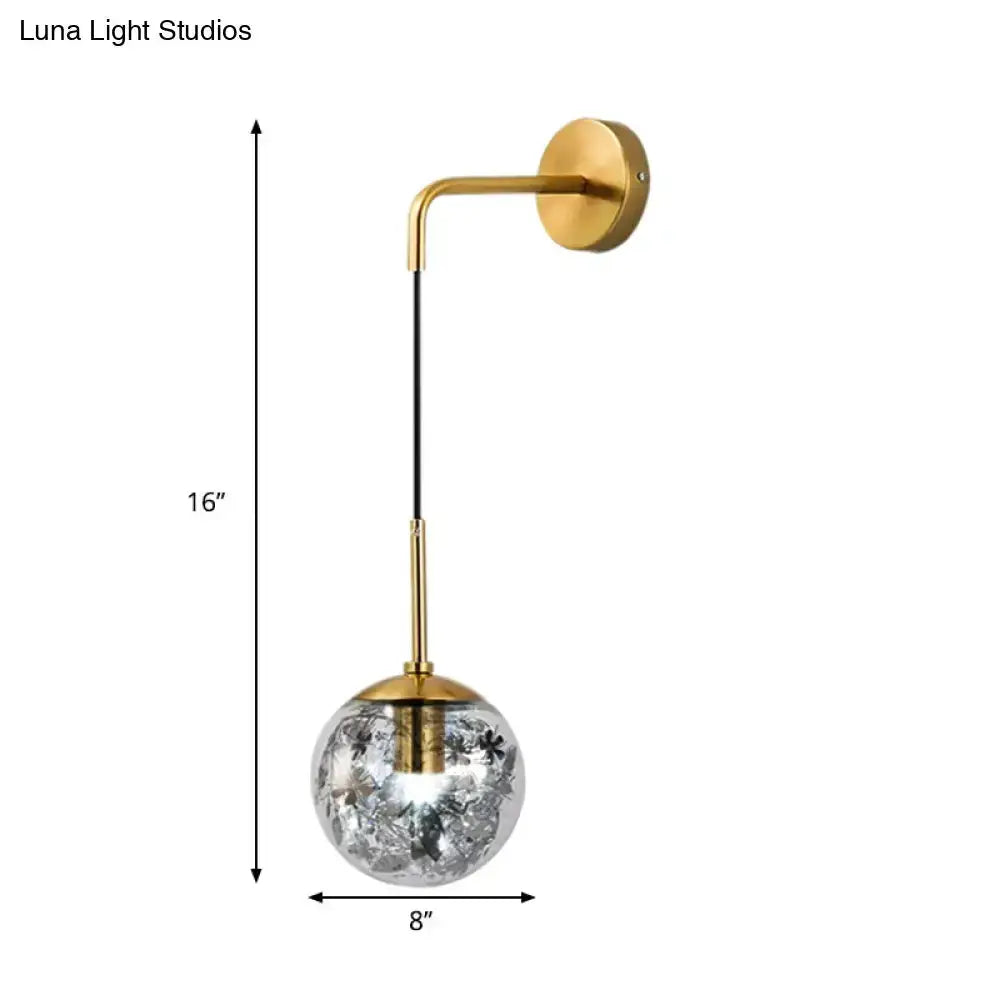 Modern gold shattered leaf clear glass globe wall sconce with curved arm Decorbites for bedroom on Tampa Home & Garden Store