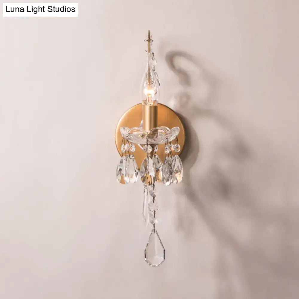 Crystal Drop Wall Sconce by Decorbites with gold brass backplate and hanging crystal prisms on Tampa Home & Garden Store