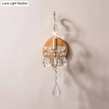Crystal Drop Wall Sconce by Decorbites with gold brass backplate and hanging crystal prisms on Tampa Home & Garden Store