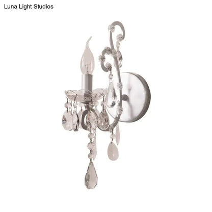 Crystal Drop Wall Sconce by Decorbites in silver with hanging crystal prisms on Tampa Home & Garden Store
