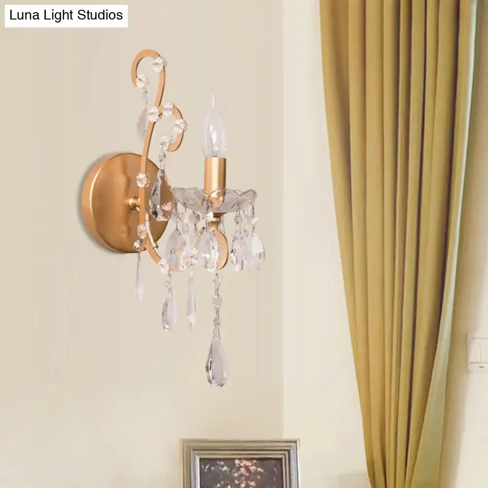 Crystal Drop Wall Sconce with brass finish and hanging crystal prisms, candle-style bulb on Tampa Home & Garden Store