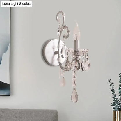 Crystal Drop Wall Sconce by Decorbites with silver finish and hanging crystal droplets on Tampa Home & Garden Store