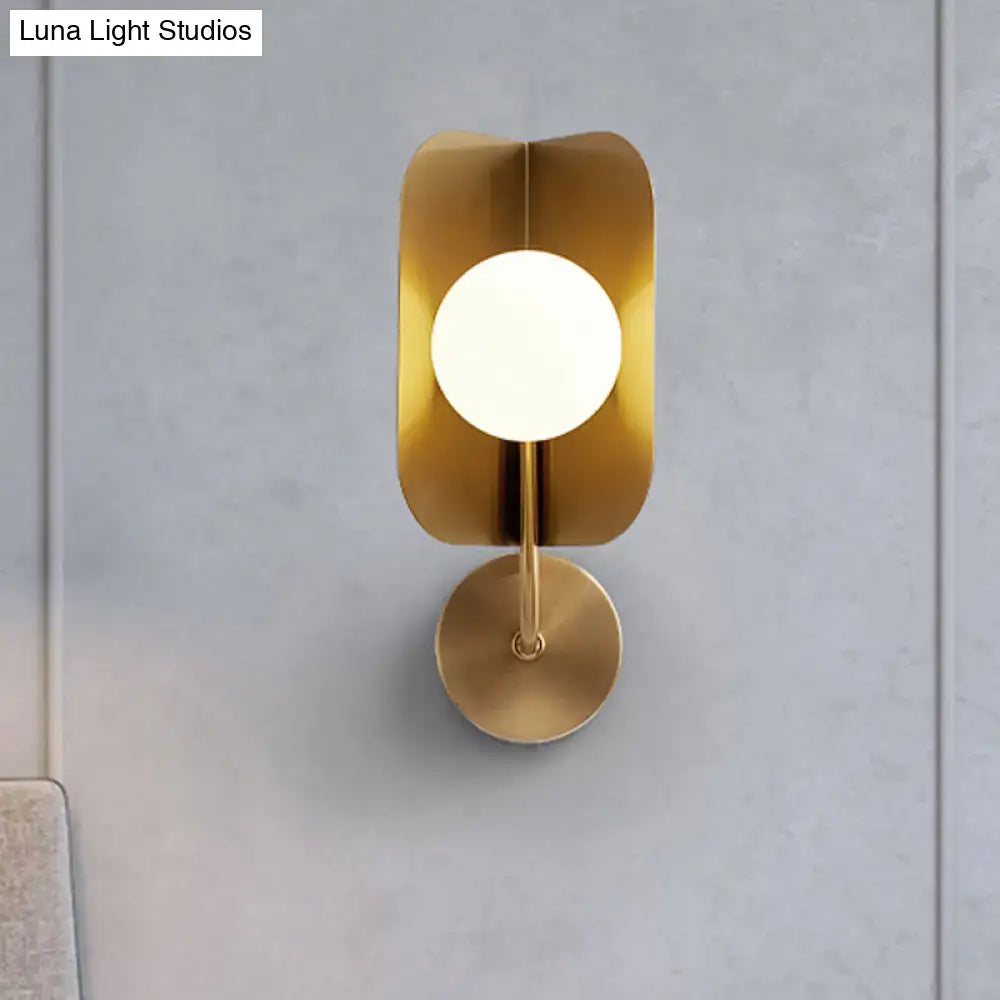 Gold Sphere Metal Sconce by Decorbites with white globe on a rounded gold backplate on Tampa Home & Garden Store