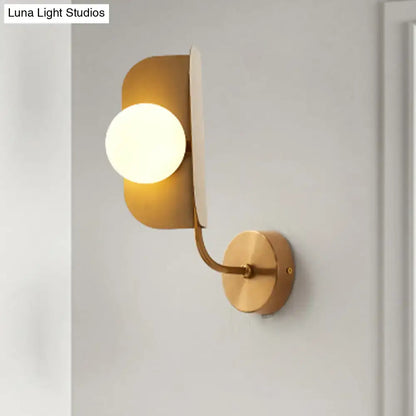 Decorbites gold sphere metal wall sconce with curved arm and round backplate on Tampa Home & Garden Store