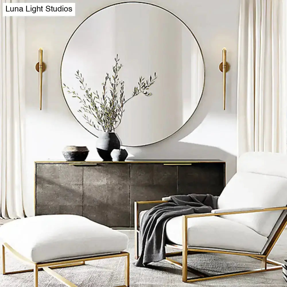 Modern gold tapered crystal LED wall lights, twin sconces beside round mirror in living room on Tampa Home & Garden Store