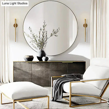Modern gold tapered crystal LED wall lights, twin sconces beside round mirror in living room on Tampa Home & Garden Store