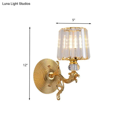 Modern gold tapered wall light fixture with crystal shade and ornate dragon scrollwork on Tampa Home & Garden Store