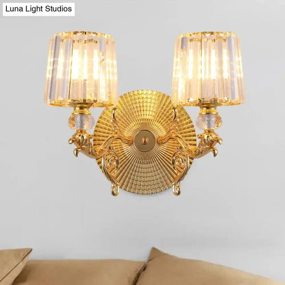 Modern gold two-light dragon wall sconce by Decorbites with crystal tapered glass shades on Tampa Home & Garden Store