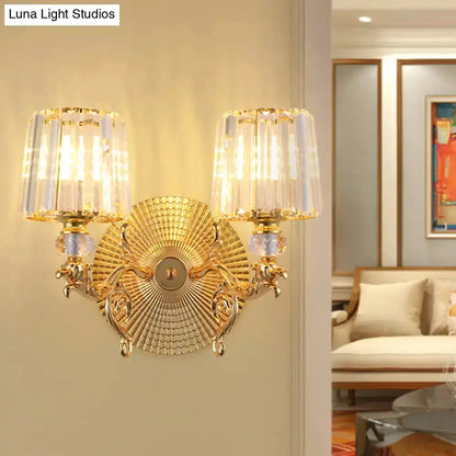 Modern gold wall sconce by Decorbites with two crystal tapered shades and sunburst backplate on Tampa Home & Garden Store