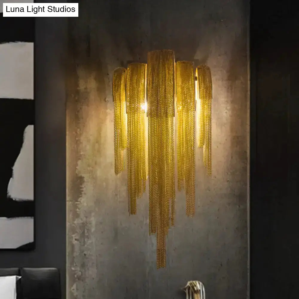 Modern gold tassel wall sconce with cascading chain tassels for living rooms on Tampa Home & Garden Store