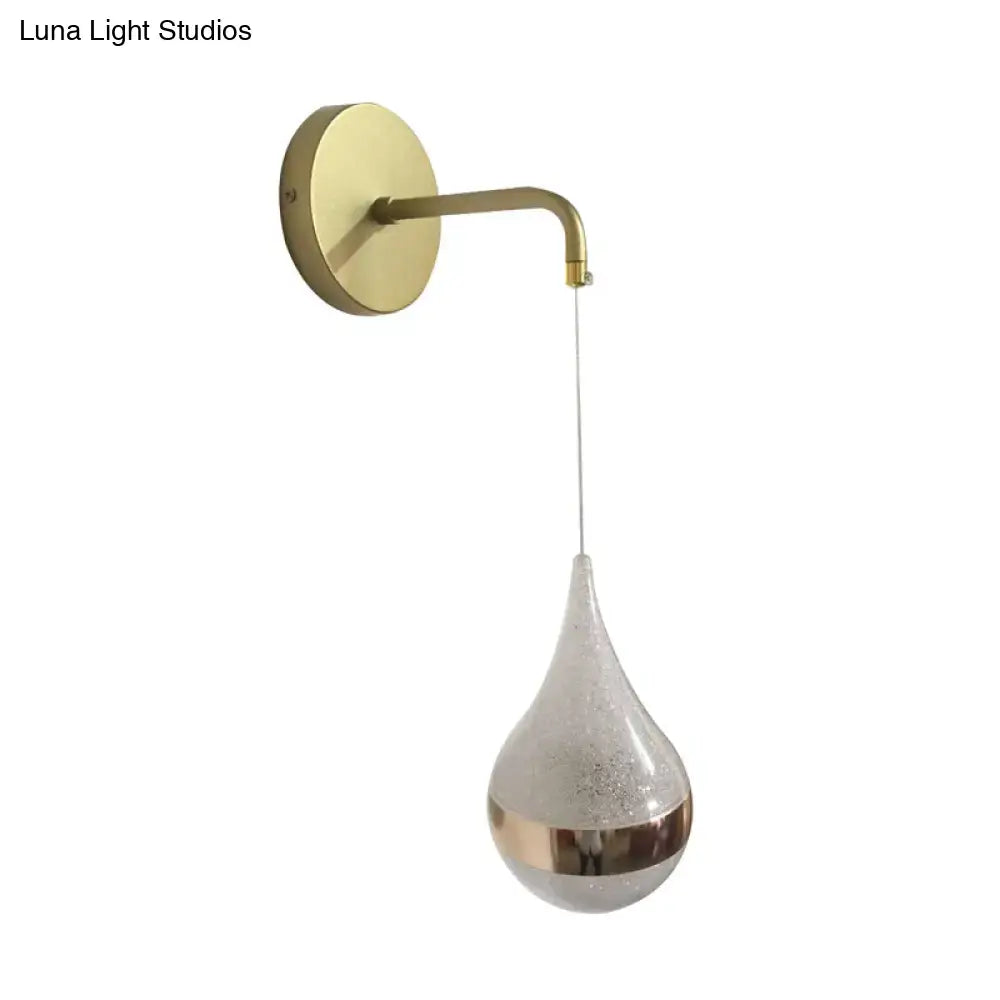 Gold teardrop wall sconce with round backplate and glass pendant by Decorbites on Tampa Home & Garden Store