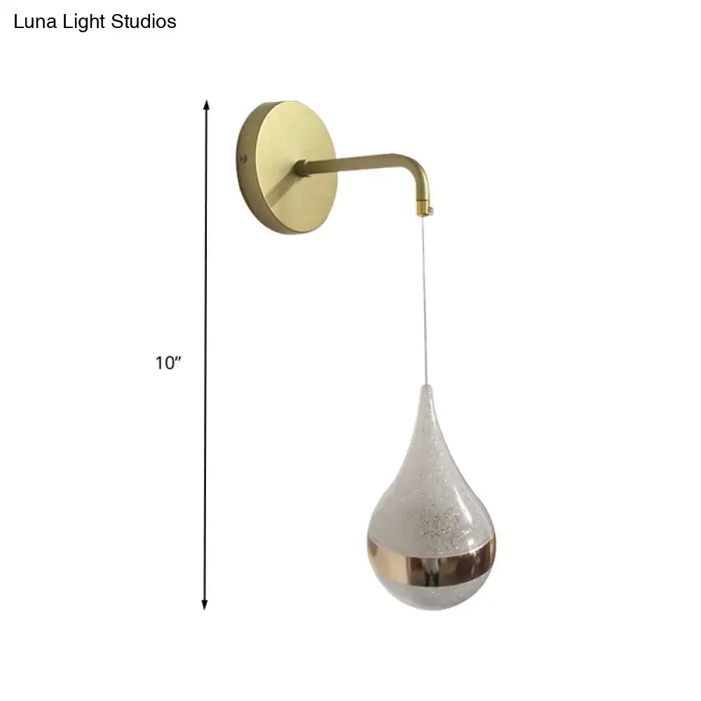 Gold teardrop wall sconce with brass arm and frosted glass shade by Decorbites on Tampa Home & Garden Store