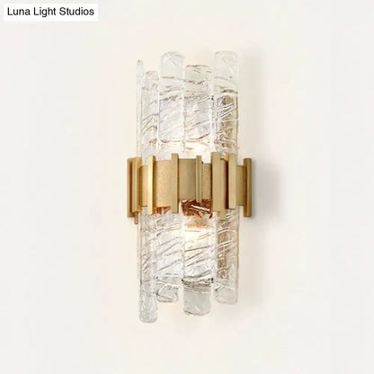 Decorbites modern gold textured glass wall sconce with vertical glass rods on Tampa Home & Garden Store