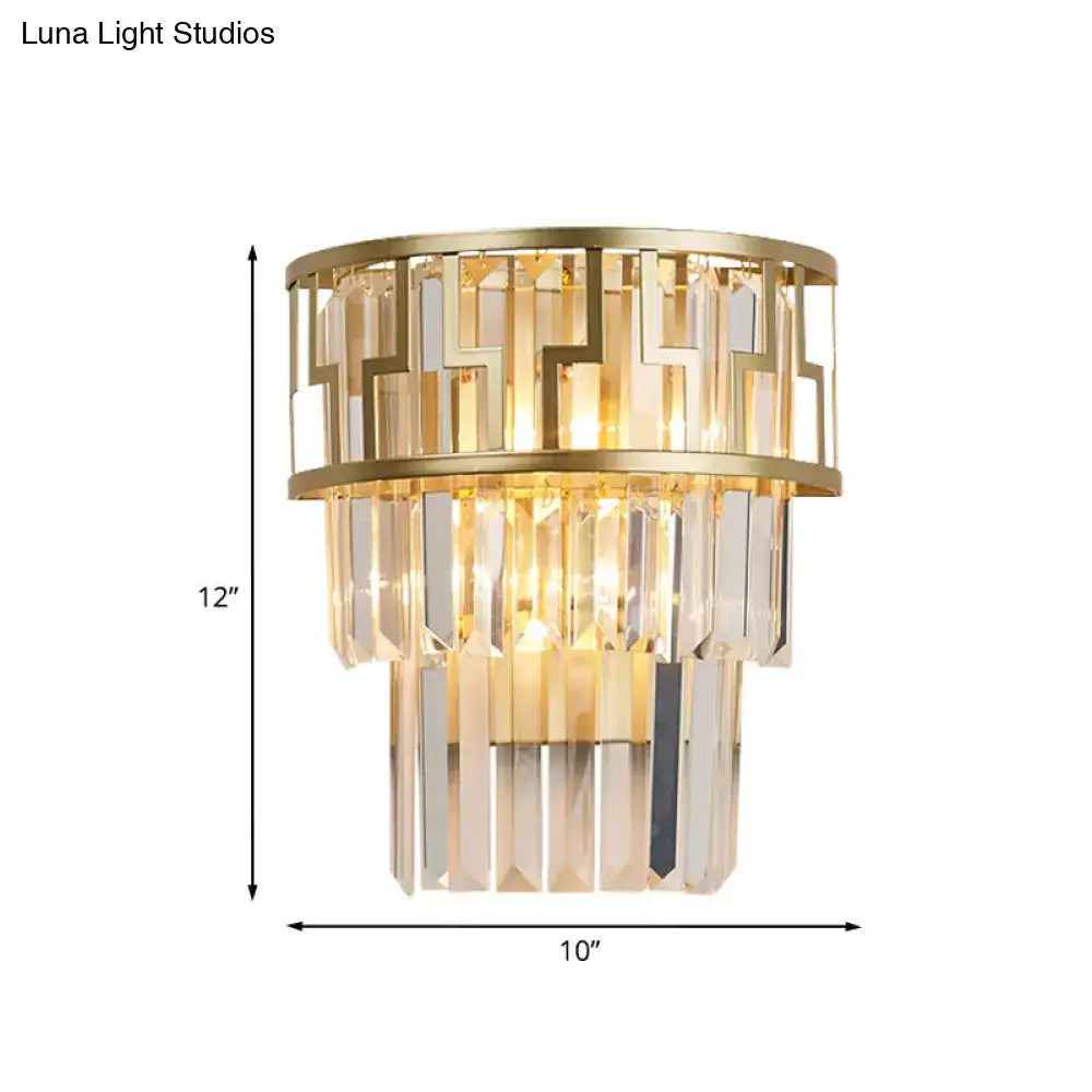Gold tiered crystal wall lamp by Decorbites with gold metal frame and hanging prisms on Tampa Home & Garden Store
