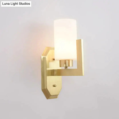 Modern gold tubular wall lamp with frosted glass shade by Decorbites for living room on Tampa Home & Garden Store