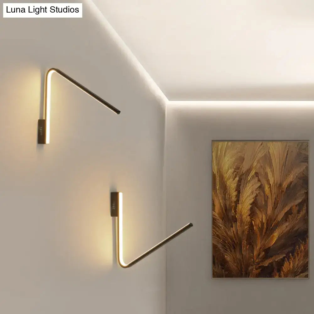Gold V-shaped wall light pair, Decorbites LED metal sconces with warm glow on walls on Tampa Home & Garden Store