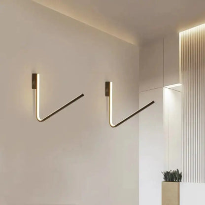 Gold V-shaped wall light pair by Decorbites; modern gold wall sconces with warm LED glow on Tampa Home & Garden Store