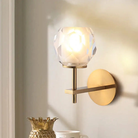 Gold faceted globe lamp by Decorbites, brass wall sconce with crystal shade on Tampa Home & Garden Store