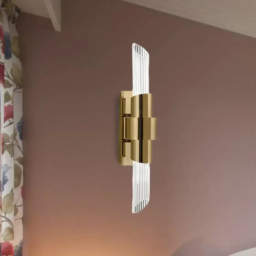 Gold prismatic crystal wall sconce by Decorbites with ribbed prisms and gold mounting on Tampa Home & Garden Store