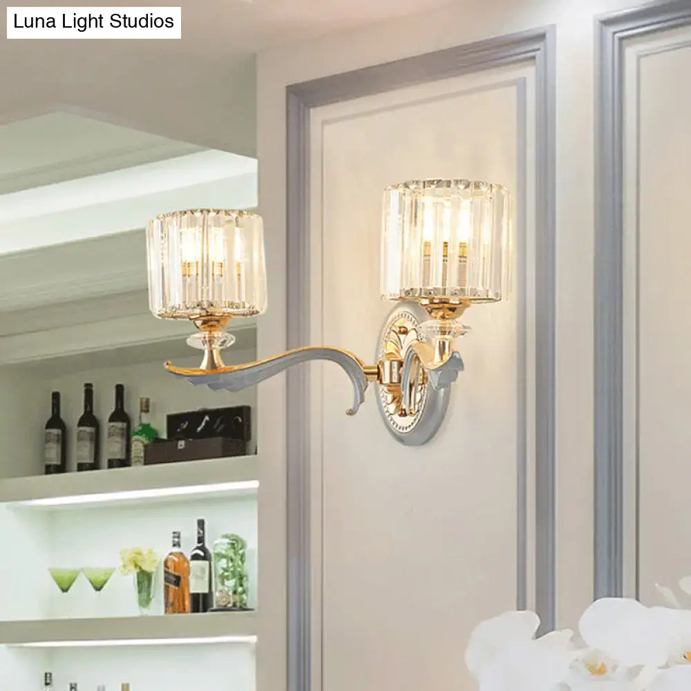 Gold Crystal Cylinder Sconce by Decorbites with curved brass arm and two crystal cylinders on Tampa Home & Garden Store