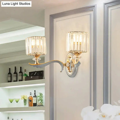 Gold Crystal Cylinder Sconce by Decorbites with curved brass arm and two crystal cylinders on Tampa Home & Garden Store