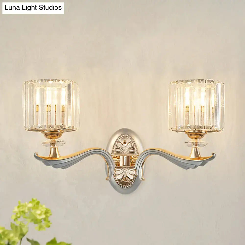 Gold crystal cylinder sconces pair by Decorbites with ornate backplates and glass shades on Tampa Home & Garden Store