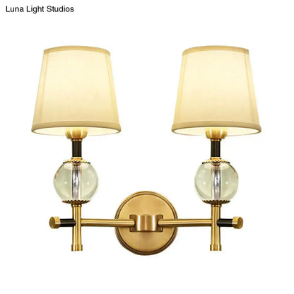 Decorbites Gold Crystal Fabric Shade 2-Light Sconce with glass globes and brass finish on Tampa Home & Garden Store
