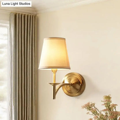 Gold fabric wall sconce with brass finish and circular backplate Decorbites Home & Garden on Tampa Home & Garden Store