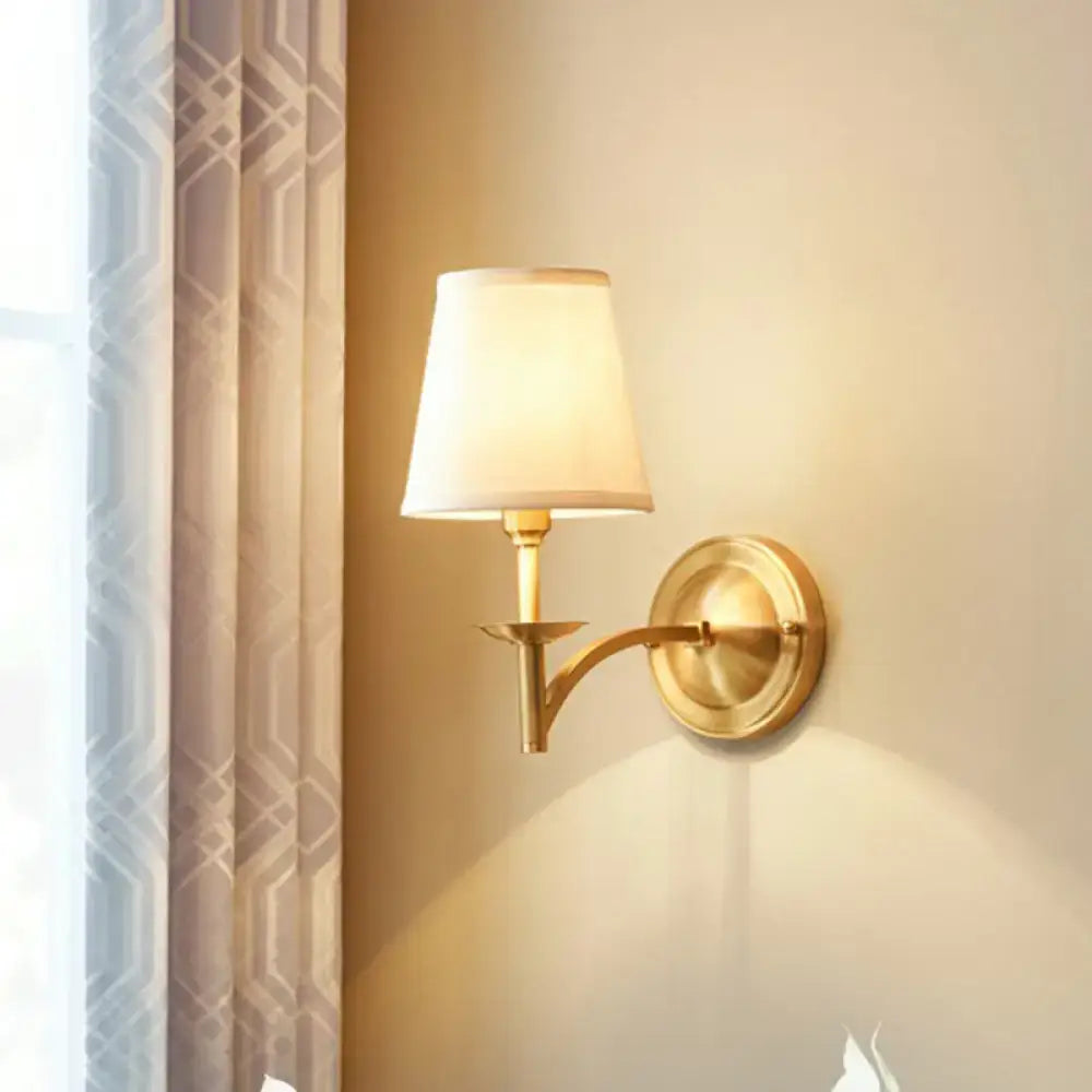 Gold Fabric Wall Sconce with curved brass arm and cream fabric shade by Decorbites on Tampa Home & Garden Store
