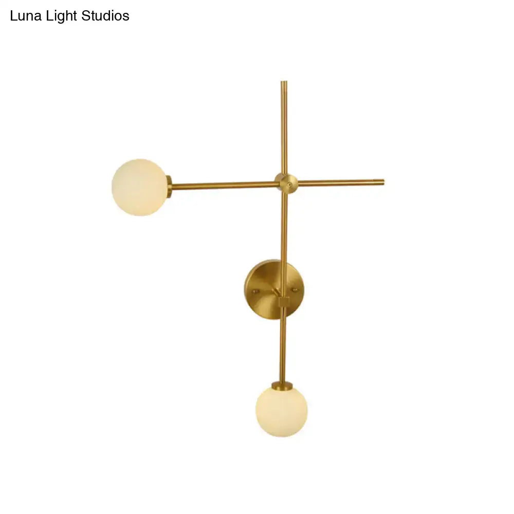 Decorbites gold glass wall lamp with brass finish and two frosted globes in crossbar on Tampa Home & Garden Store