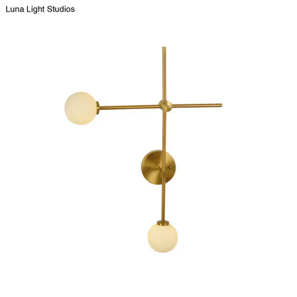 Decorbites gold glass wall lamp with brass finish and two frosted globes in crossbar on Tampa Home & Garden Store