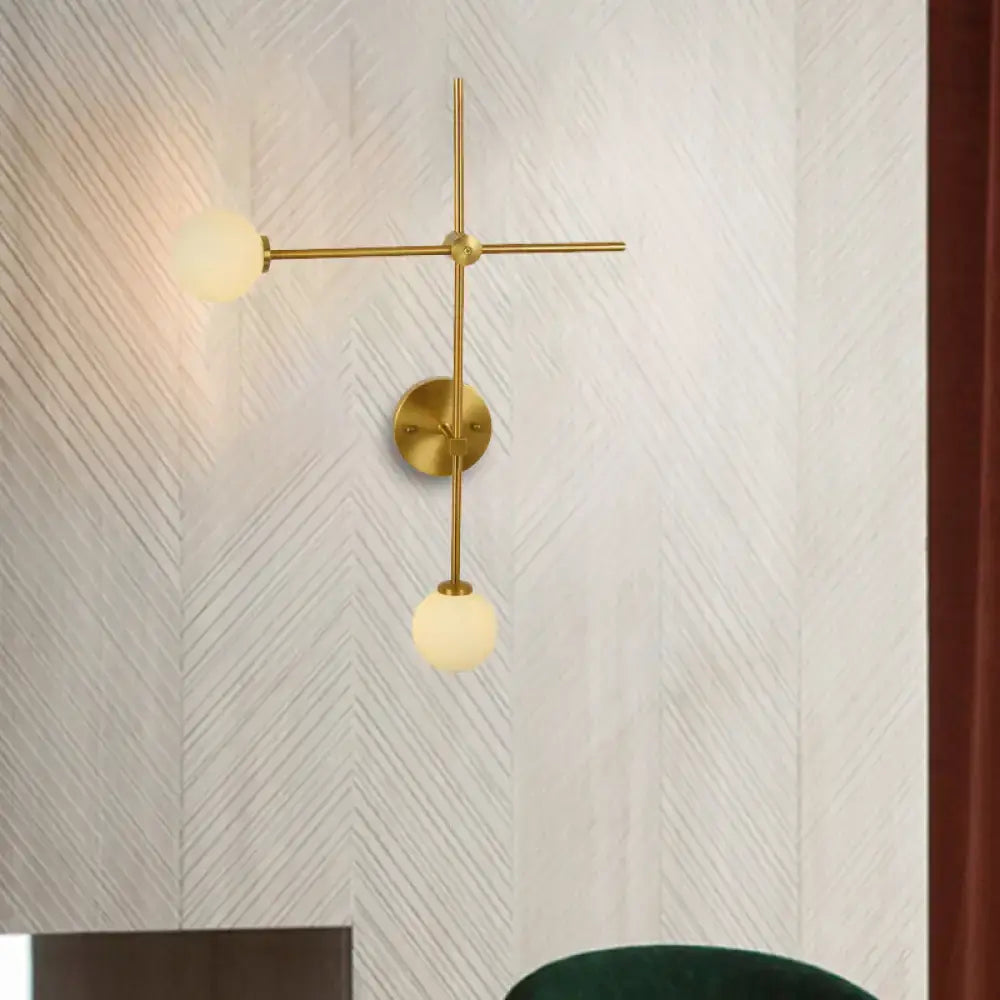 Gold glass wall lamp with two frosted globes and brass crossbar on wall mount on Tampa Home & Garden Store