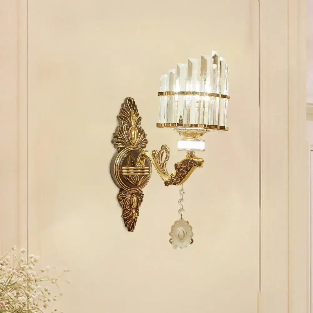 Gold arc crystal sconce with ornate backplate, crystal shade, and hanging pendant by Decorbites on Tampa Home & Garden Store
