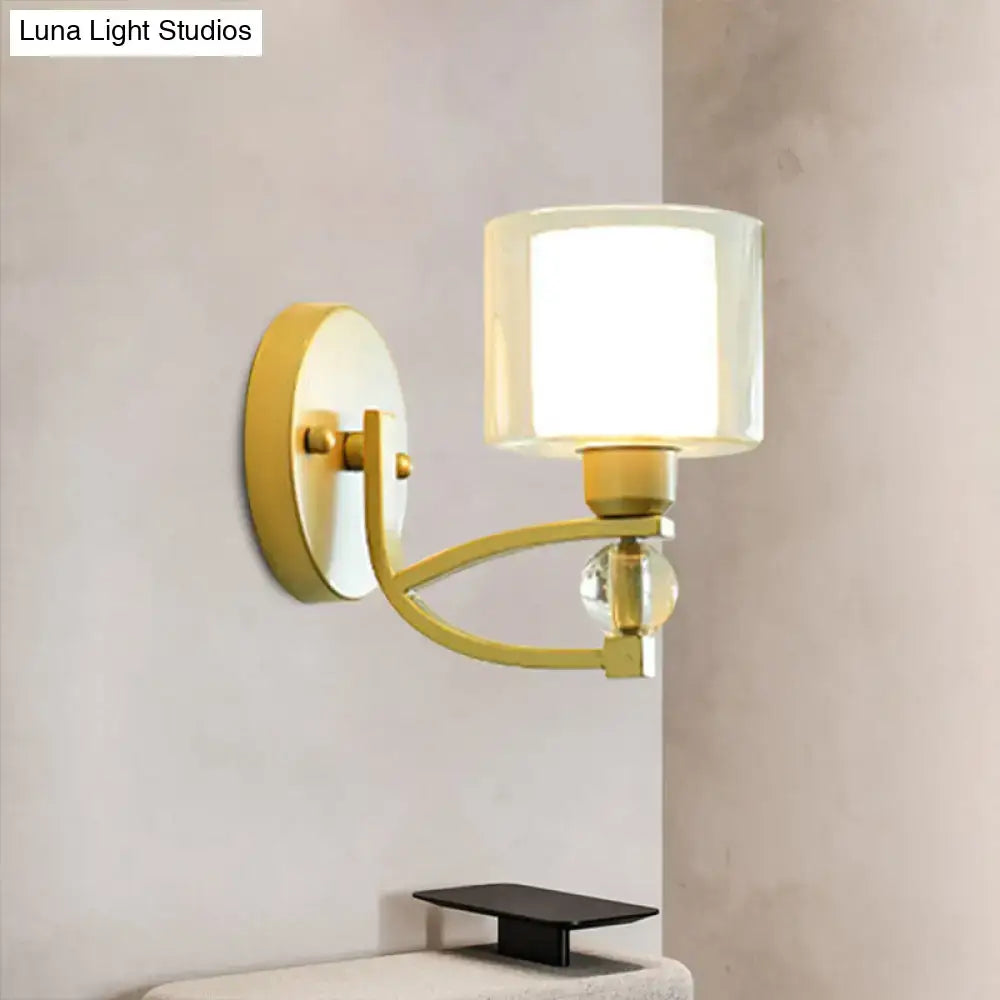 Gold dual glass sconce with curved brass arm and glass shade Decorbites on Tampa Home & Garden Store