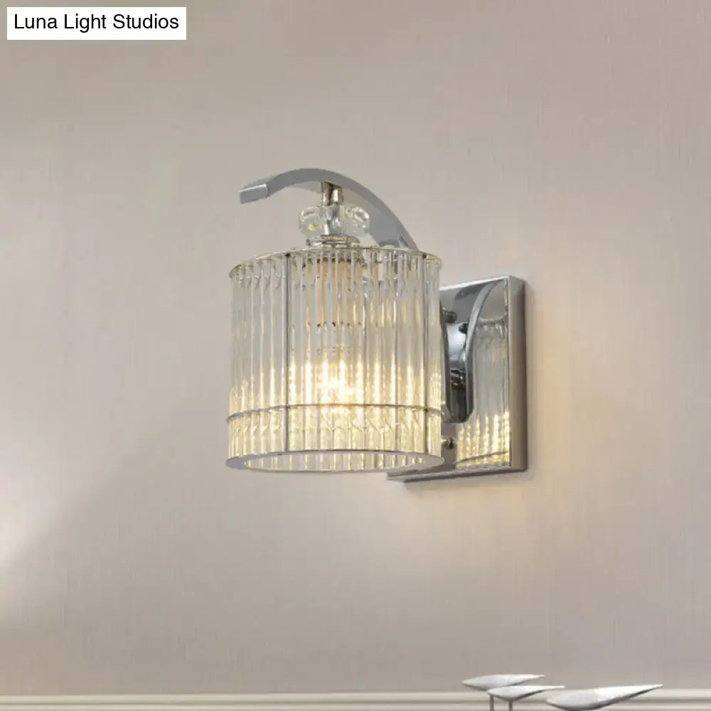 Gold crystal wall sconce with crystal cylinder shade on chrome backplate on Tampa Home & Garden Store