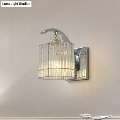 Gold crystal wall sconce with crystal cylinder shade on chrome backplate on Tampa Home & Garden Store
