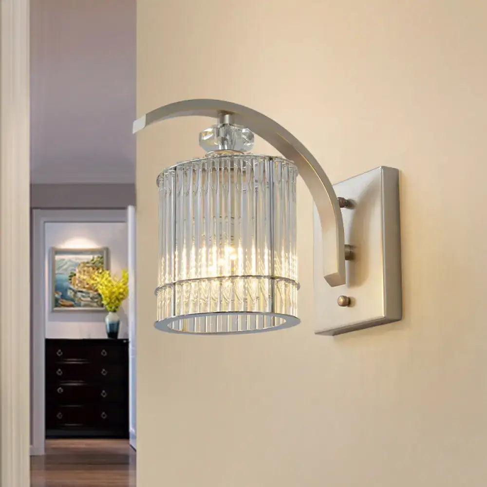Gold crystal wall sconce by Decorbites; curved arm, crystal cylinder shade, E12-E14 base on Tampa Home & Garden Store