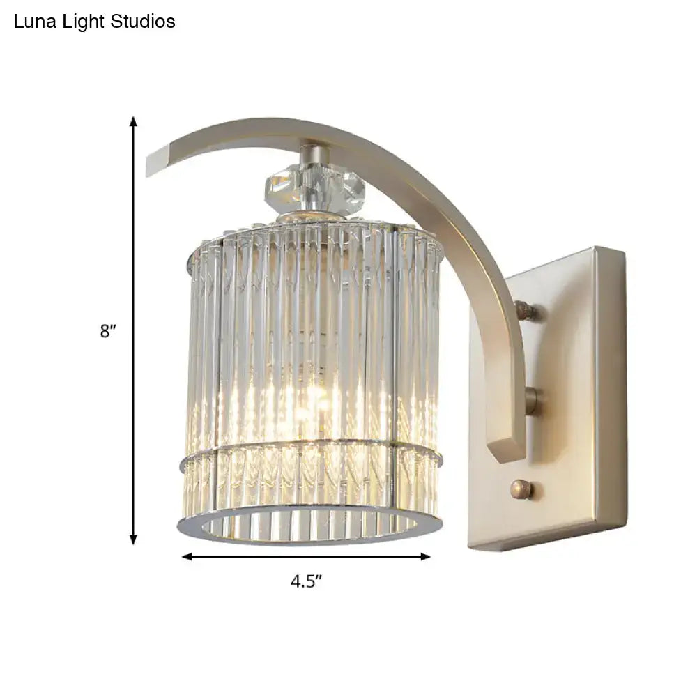 Decorbites gold crystal wall sconce with curved arm and crystal cylinder shade E12-E14 base on Tampa Home & Garden Store