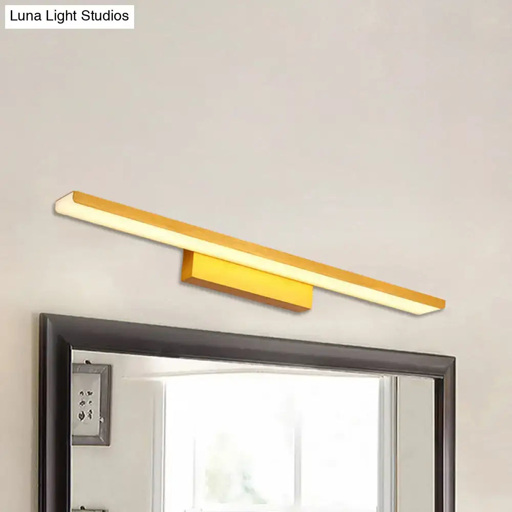 Gold LED slim 24.5-inch vanity light by Decorbites with frosted diffuser above a mirror on Tampa Home & Garden Store
