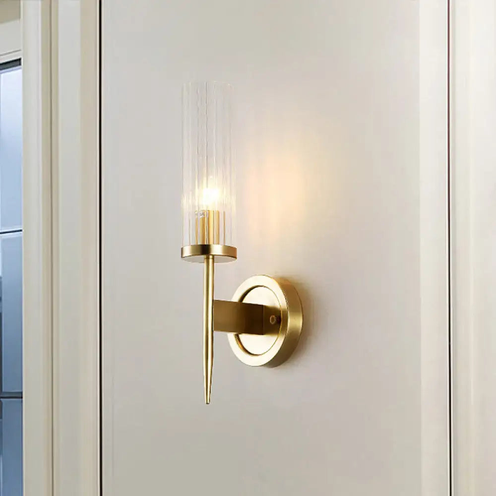 Gold ribbed glass wall sconce by Decorbites with brass finish and round backplate on Tampa Home & Garden Store