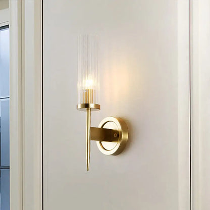 Gold ribbed glass wall sconce by Decorbites with brass finish and round backplate on Tampa Home & Garden Store