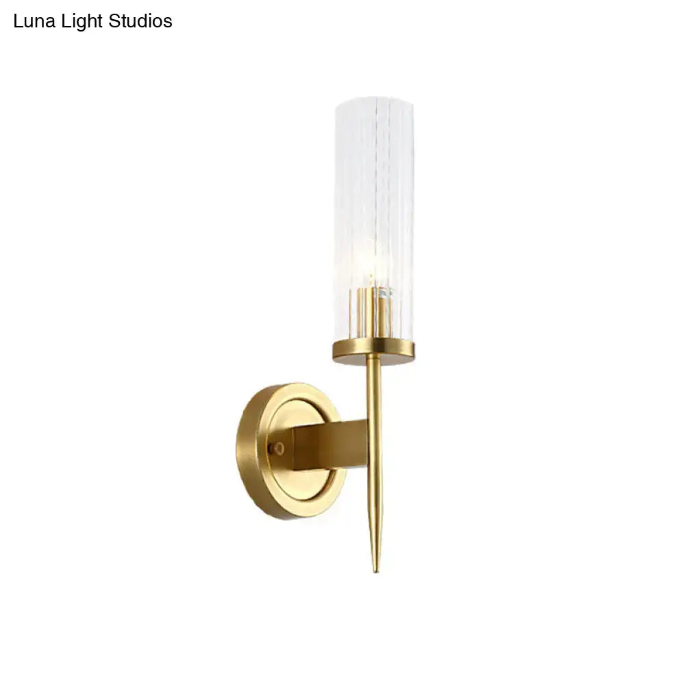 Gold Ribbed Glass Sconce with brass wall mount and clear ribbed glass cylinder shade on Tampa Home & Garden Store