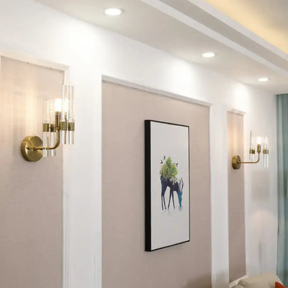 Pair of gold crystal pipe sconces with glass cylinder shades on durable metal build Decorbites on Tampa Home & Garden Store