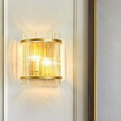 Gold crystal dual-head rod sconce with brass bands and vertical glass rods on Tampa Home & Garden Store